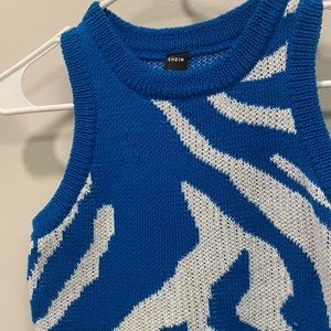White and blue vest